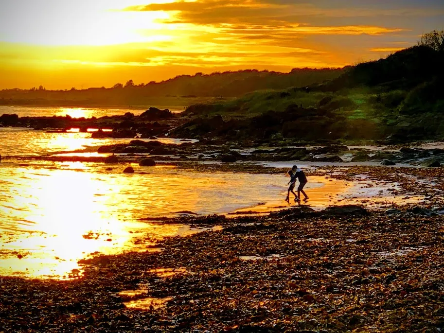 Kids on Scotland Coastline beach