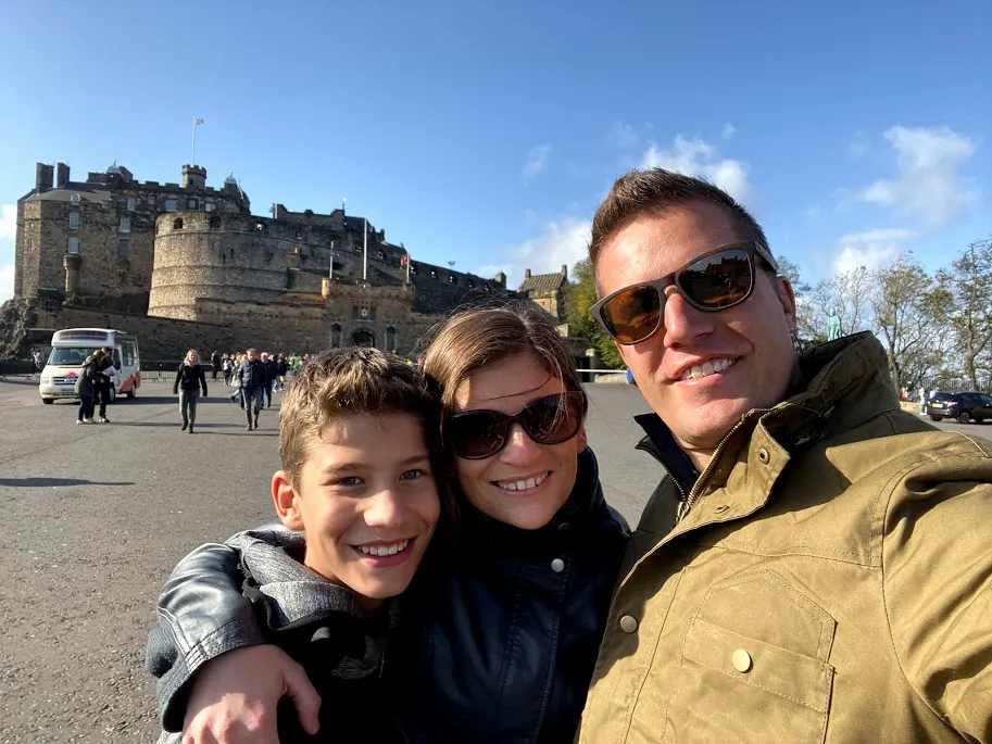 Parents with teen boy in front of Edinburgh Castle