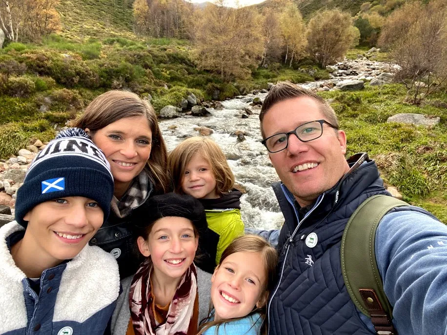 Family in Scotland by waterfall