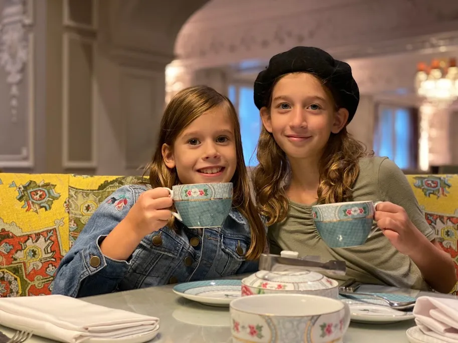 Kid sisters having afternoon tea