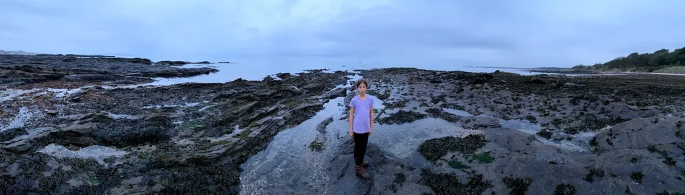 Panoramic picture of girl on Lower Largo beach