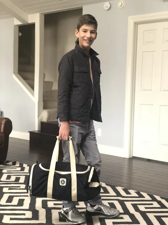 Teen Boy with Duffel Bag