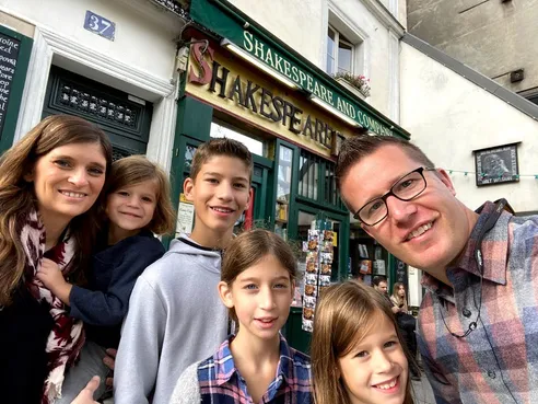 Family in front of Shakespeare and Company bookstore