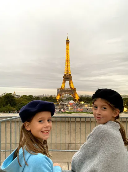 Young girls in berets with Eiffel Tower